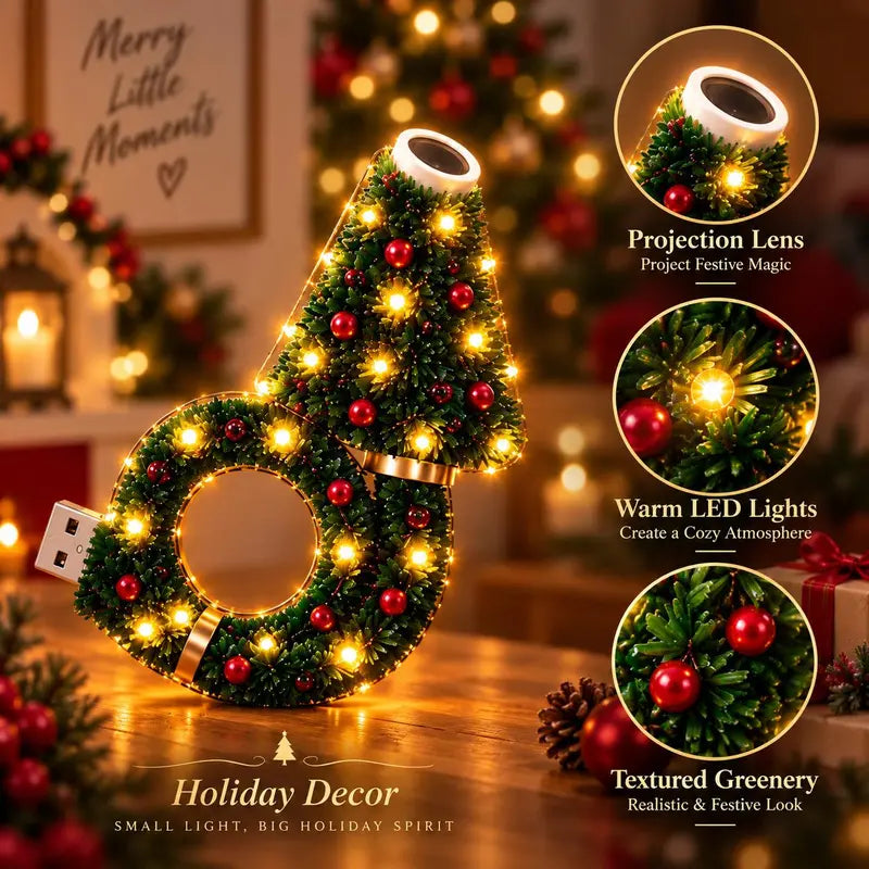Christmas projector light showing the projection lens, warm LEDs and decorative greenery