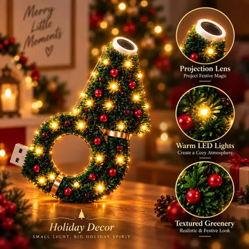 Christmas projector light showing the projection lens, warm LEDs and decorative greenery